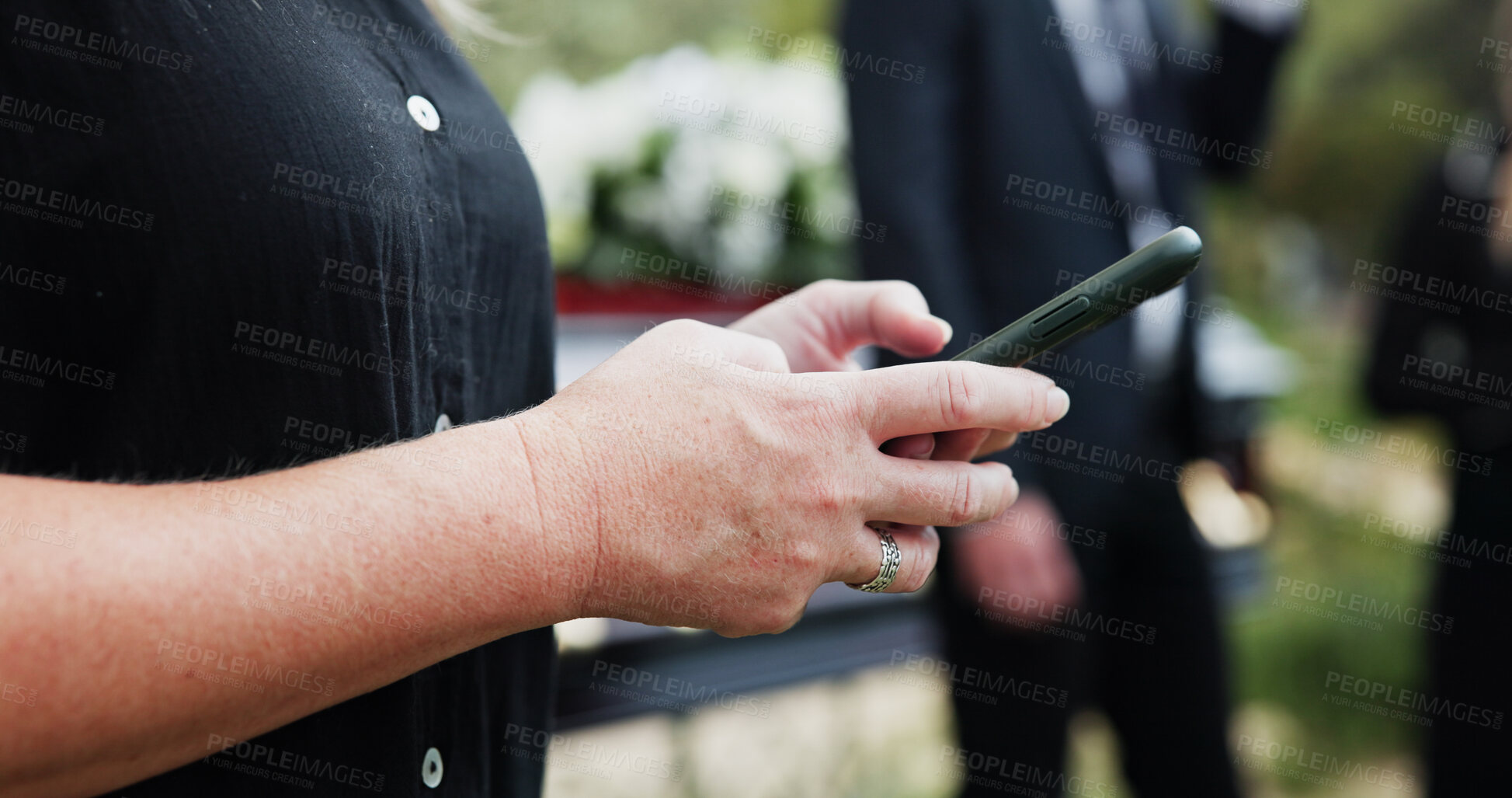 Buy stock photo Funeral, hands and woman in cemetery, cellphone for online chatting and post for memory. Family, connection and person in graveyard, smartphone and message to contact and digital app for social media