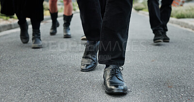 Buy stock photo People, shoes and walking at graveyard with funeral procession, loss and burial ceremony outdoor. Person, feet and journey in cemetery with family mourning, memorial service and grief together