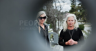 Buy stock photo Sad, funeral and senior women at graveyard with grief, support or loss at burial ceremony with circle space. Family, death and elderly people with mourning at cemetery outdoor at memorial service.
