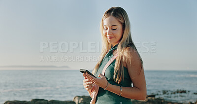 Buy stock photo Smile, typing and phone with woman at beach for travel blogger, social media and summer vacation post. Communication, online holiday guide and contact with person outdoor for tourism and chat