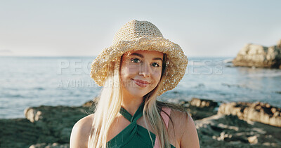 Buy stock photo Travel, sunhat and portrait of woman at beach for summer vacation, relax and tropical adventure. Happiness, weekend break and getaway trip with female person outdoor for tourism, island and coastline