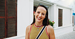 Portrait, woman and smile in town with summer holiday, weekend getaway or travel for tourist adventure. Happy, female person and outdoor with downtown exploration, positive attitude or vacation trip.