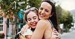 Friends, hug and women with smile in city, reunion and bonding with support on weekend or solidarity. Outdoor, together and happy people with affection on break, friendship and embrace on street