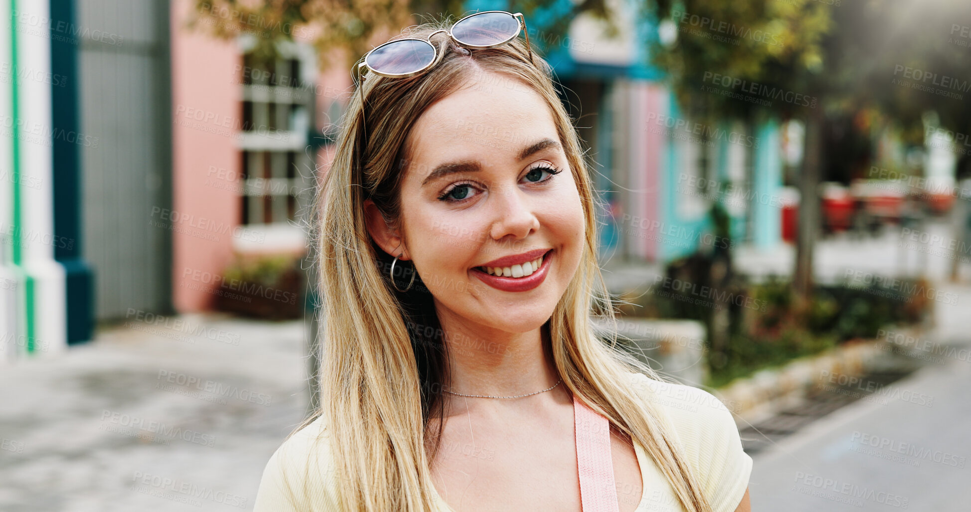 Buy stock photo Portrait, woman and happy in town with summer holiday, weekend getaway or travel for tourist adventure. Female person, smile and outdoor in city with exploration, positive attitude and vacation trip.