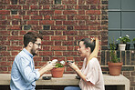 Coffee, laughing and love with couple in garden of home together for bonding or conversation. Dating, drink and funny with happy people in apartment backyard for connection, humor or security