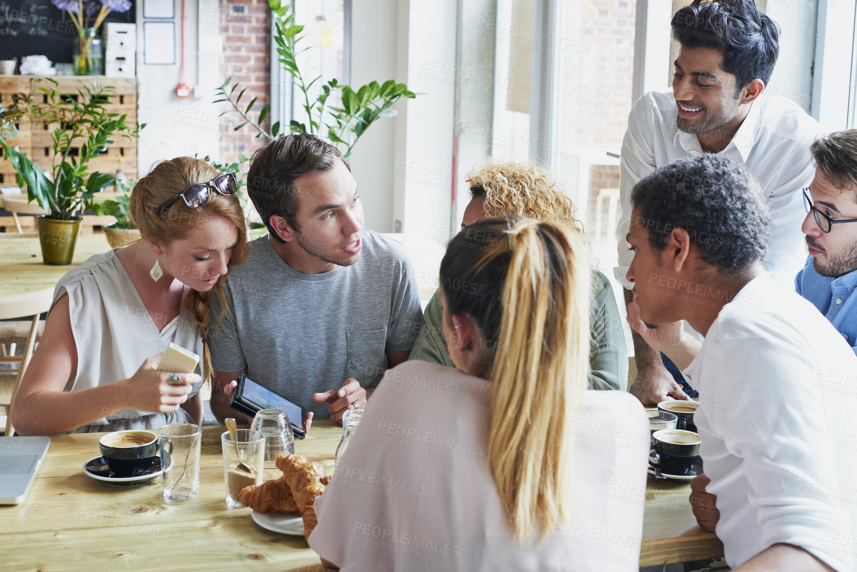 Buy stock photo Conversation, coffee and group of friends in cafe for bonding, catch up or social gathering. Phone, talking and people on break together in morning with discussion or connection in restaurant.