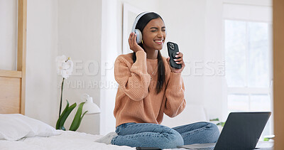 Buy stock photo Phone, headphones and woman in home, listening to music and digital app for song. Subscription, smile and person in bedroom, live streaming for radio and energy with online audio, singing and karaoke
