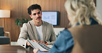 Interview, hiring and man in office with resume, discussion or meeting in onboarding process. Contract review, talk or recruiter in agency with document, candidate or proposal for career opportunity