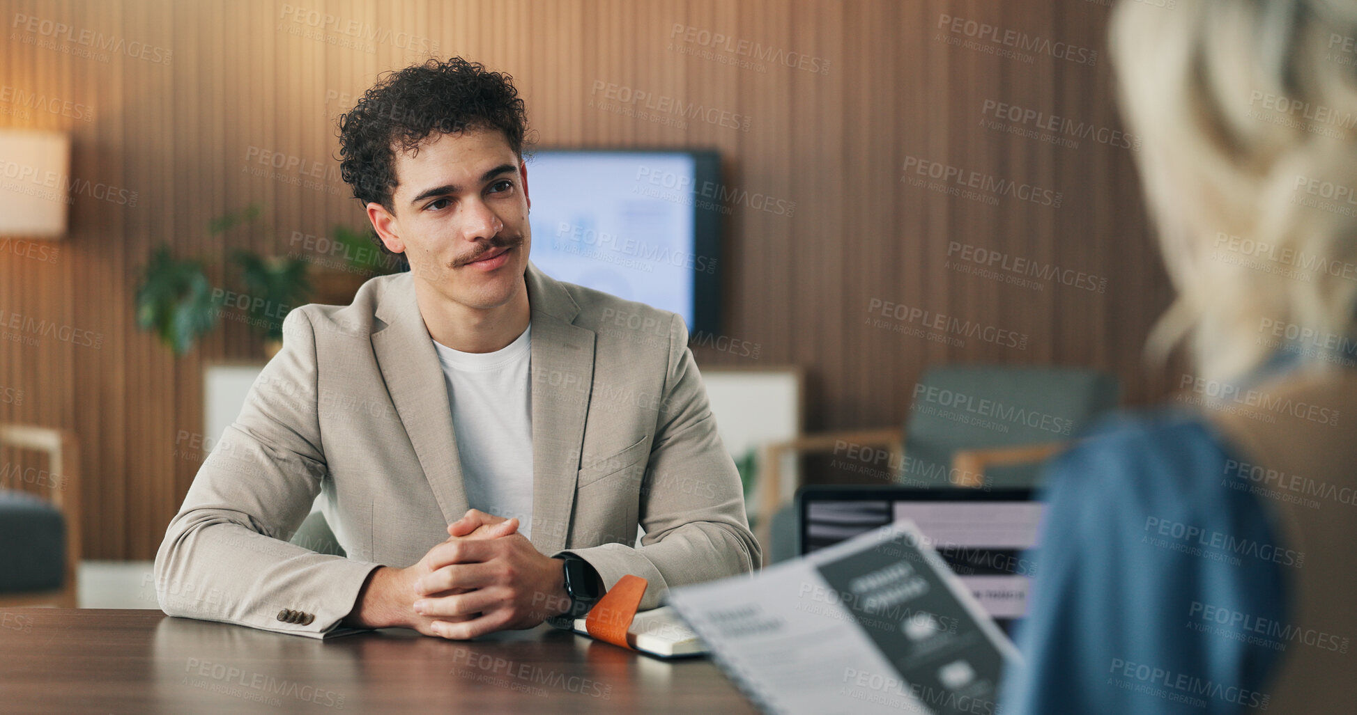 Buy stock photo Interview, hiring and man in office with portfolio, resume or meeting in onboarding process. Contract review, talk or recruiter in agency with document, candidate or proposal for career opportunity
