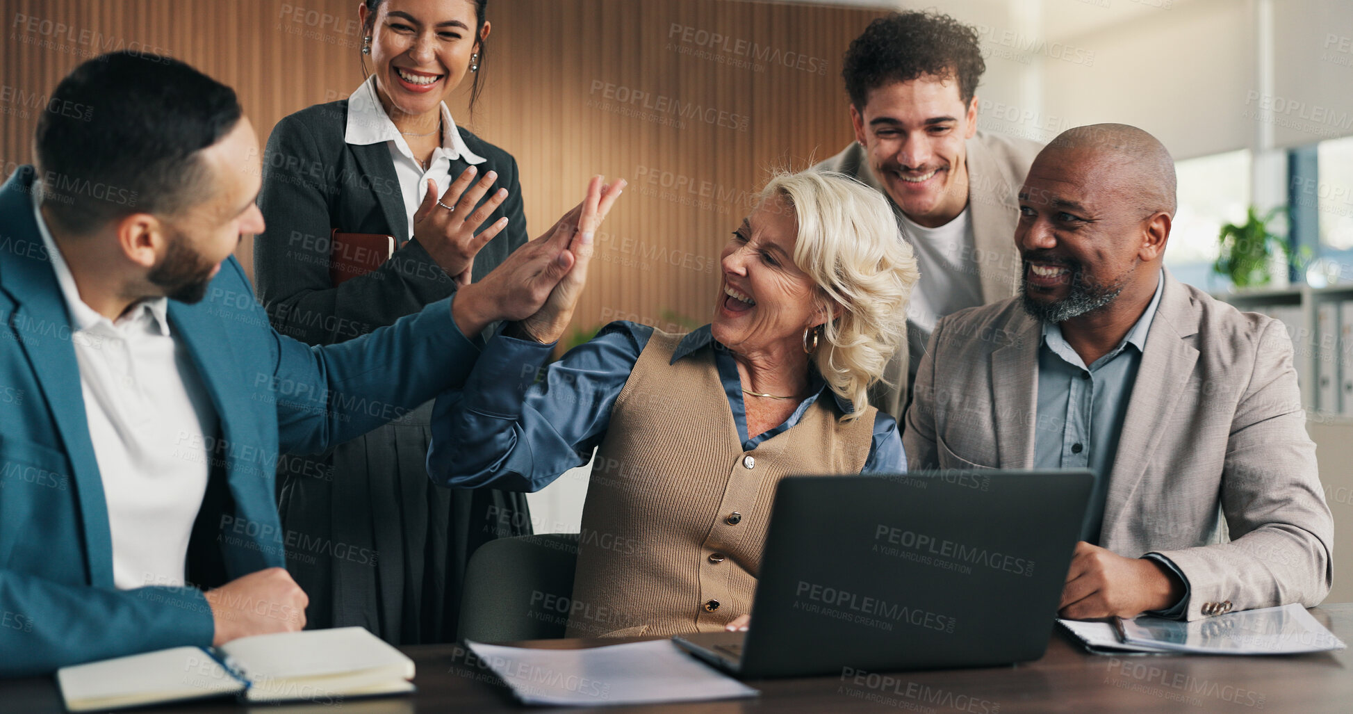 Buy stock photo Celebration, business people and high five with applause on laptop for team promotion or success in office. Excited, employees and clapping with winning, tech and good news or company achievement