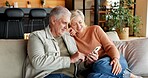 Laughing, home and senior couple with phone, connection or watching funny movie on website in lounge. Mature people, smile and streaming comedy with partner, online and bonding with mobile in house