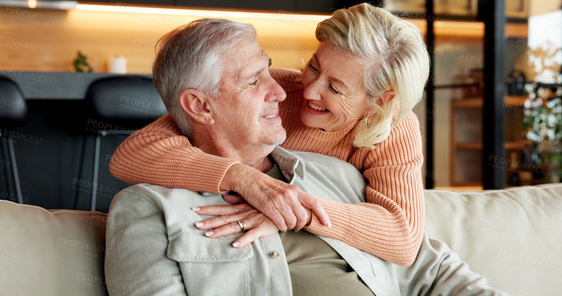 Buy stock photo Love, home and senior couple with smile, laughing and connection with partner on break and affection. Happy, mature people and bonding on weekend, embrace and commitment for relationship in house