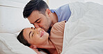 Love, couple and kiss in bed for connection, relationship wellness and happiness together. Romance, man and woman in bedroom with partner to relax at home, marriage commitment or smile for affection
