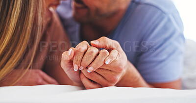 Buy stock photo Love, couple and holding hands in bed for connection, relationship wellness and security together. Care, man and woman in bedroom with partner to relax at home, marriage commitment and affection