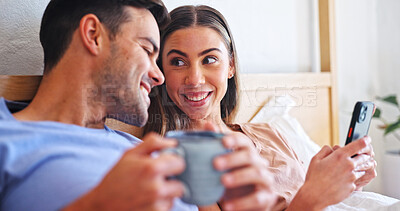 Buy stock photo Happy, couple and relax with phone in bed for social media, network or morning together in home. Man, woman or coffee with smile on smartphone in bedroom for mobile entertainment, chatting or texting