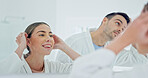 Couple, mirror or grooming with partner in bathroom for beauty, skincare or morning routine together. Man, woman or smile with reflection for hair styling, appearance or facial cosmetics in house