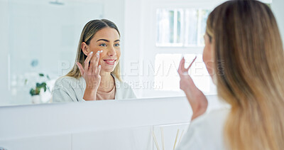 Buy stock photo Mirror, skincare and happy woman with cream in bathroom for hydration, skin wellness and beauty. Smile, person and apply facial lotion in morning routine, dermatology benefits or reflection at home