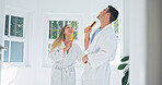 Happy, couple and singing in bathroom with brush for fun morning or bonding together in home. Man, woman or dancing with smile, karaoke or hairbrush for playful grooming, holiday or weekend in house