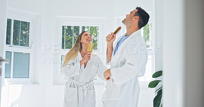Buy stock photo Happy, couple and singing in bathroom with brush for fun morning or bonding together in home. Man, woman or dancing with smile, karaoke or hairbrush for playful grooming, holiday or weekend in house