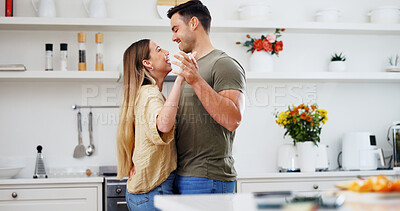 Buy stock photo Smile, couple and holding hands in kitchen for dancing, love and partner affection for celebration. Happy, people and moving at house with dancer, listening to music and romantic date for anniversary