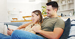 Laugh, tablet and couple in home for relax, booking vacation or planning trip on sofa together. Technology, funny man and woman in living room, travel guide or check website for holiday itinerary