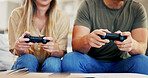 Gaming, hands and hobby with couple on sofa in home living room for activity, bonding or competition. Console, controller and video game with people in apartment together for break or online play