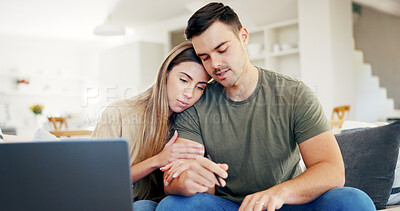 Buy stock photo Sad, laptop and couple on sofa in home for finance planning, bills or debt review in living room. Upset, support and man with woman on computer for low savings, financial problem or investment loss.