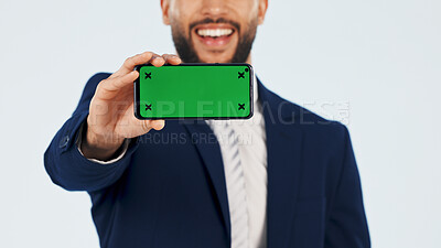 Buy stock photo Green screen, phone and space with hand of businessman in studio for information, offer or promotion. Display, mobile and mockup with happy employee on white background for announcement or review