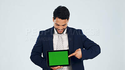 Buy stock photo Green screen, mockup and tablet with business man in studio for information, offer or promotion. Display, space and technology with happy employee on white background for announcement or review