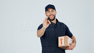 Buy stock photo Delivery man, OK sign and box in studio for shipping vote, approval or yes for courier service. Happy person, package or portrait for logistics space, dropshipping agreement or gesture on background