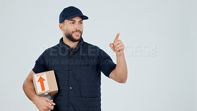 Buy stock photo Delivery man, box and pointing at space for shipping guide, info or steps for courier service. Happy person, package or parcel with logistics, dropshipping menu or list mockup on studio background