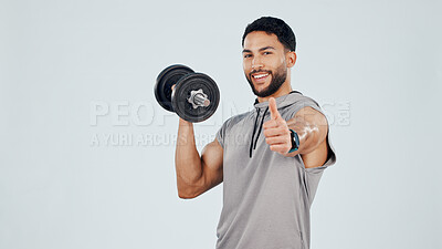 Buy stock photo Portrait, man and dumbbell in studio with thumbs up, fitness goals and bodybuilder strength training. Mockup space, person and workout with equipment, like sign and bodybuilding on white background.