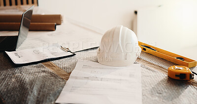 Buy stock photo Construction, paperwork and helmet with laptop for renovation, building design or planning. Architecture, equipment or floor plan on site for real estate development, safety gear or drafting document