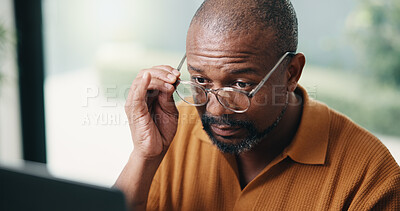 Buy stock photo Author, glasses and black man with laptop in home for online book, reading or digital manuscript. Mature person, writer or spectacles on tech for article publication, story writing or news in house