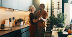 Happy, dancing and mature couple in kitchen for cooking, bonding and love with music, song and meal prep. Interracial, marriage and senior man and woman with radio for dinner, lunch and food in home