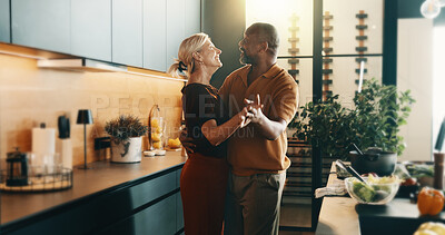 Buy stock photo Happy, dancing and mature couple in kitchen for cooking, bonding and love with music, song and meal prep. Interracial, marriage and senior man and woman with radio for dinner, lunch and food in home