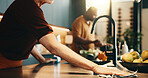 Person, hands or cleaning in kitchen for hygiene, cooking preparation or sanitary disinfection. Woman, wiping or surface with cloth or meal prep for dirt, bacteria or germ removal on counter in house