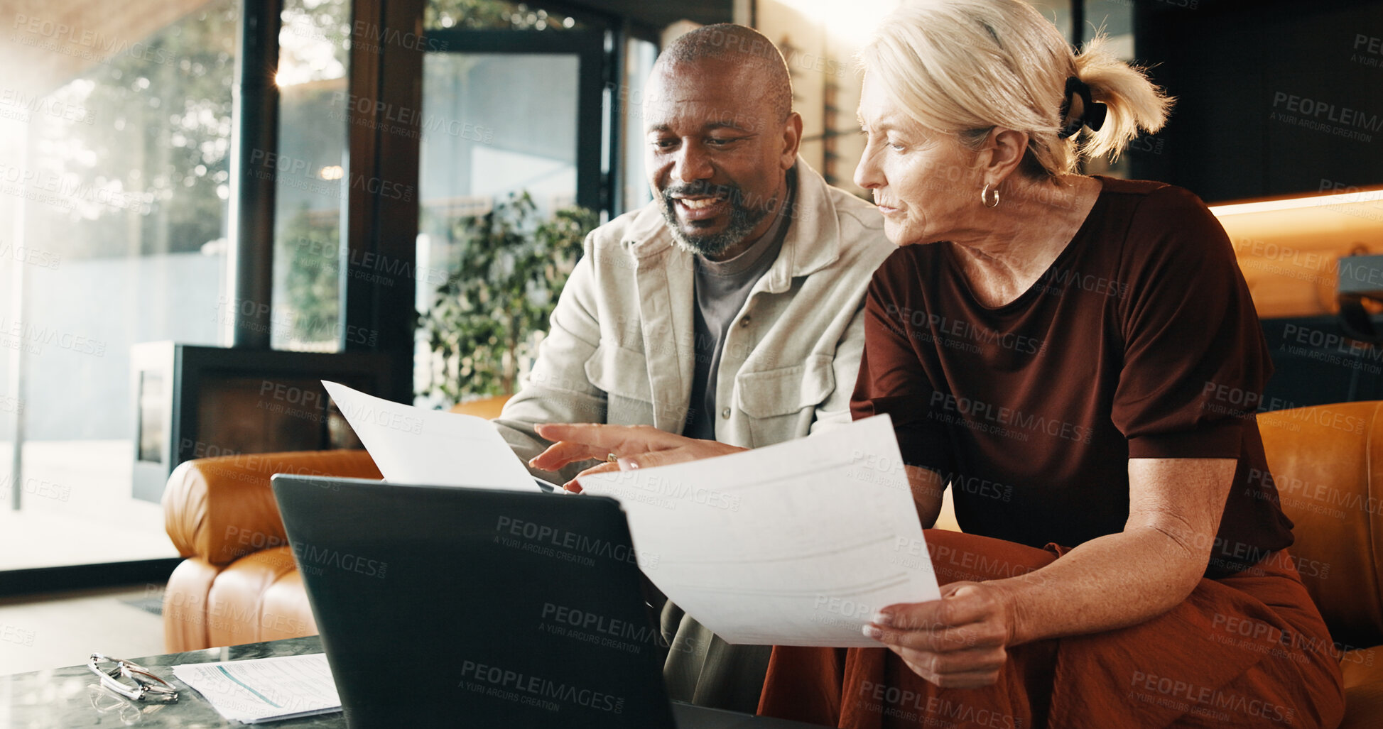 Buy stock photo Finance, documents and mature couple with laptop in home for budget report or expenses together. Interracial people, smile or computer with paperwork for financial planning or investment in house