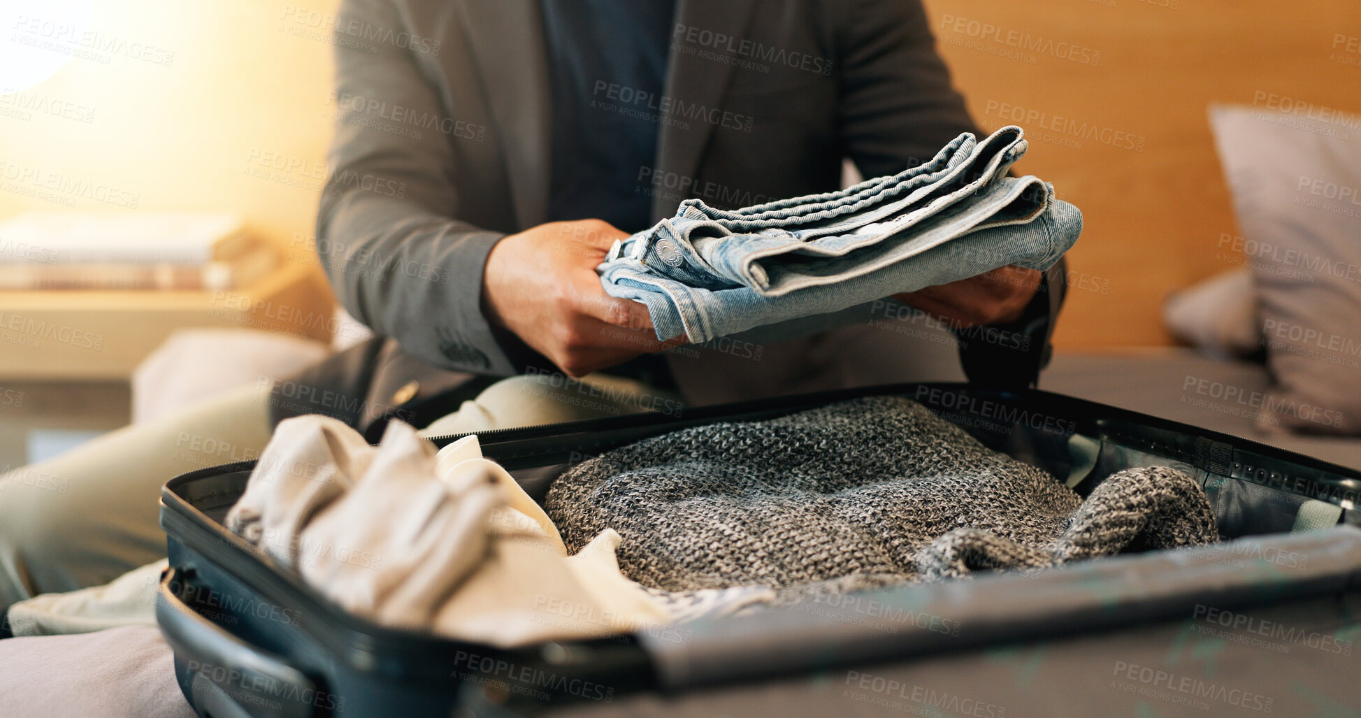 Buy stock photo Suitcase, packing and hands of man in hotel with clothes for work trip, travel or checkout at resort. Business, luggage and person with bag, outfit or fold for departure, ready or prepare for commute