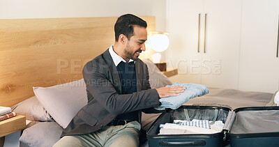 Buy stock photo Suitcase, packing and business man in hotel with clothes for work trip, travel and checkout at resort. Bed, luggage and person with bag, outfit and fold for departure, ready or prepare for commute