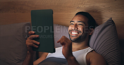 Buy stock photo Man, laugh and relax with tablet on bed, entertainment or watching comedy series at night in bedroom. Evening, rest and happy person with tech for funny film, online and app subscription in house