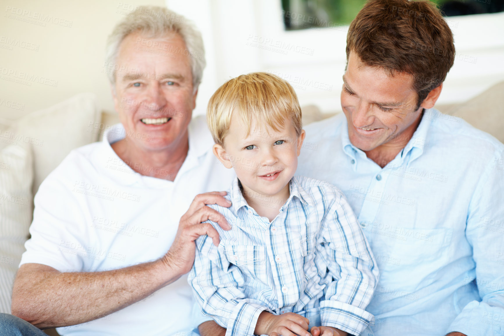Buy stock photo Home, portrait and grandpa with dad and child for love, bonding and relax together on weekend. Generations, family and boy with senior man, father and smile for relationship, care and laugh on sofa