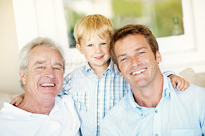 Buy stock photo Family, men and kid in home with smile, love and bonding together with affection. Portrait, father or grandfather embrace in living room with child, connection and generations relationship at house