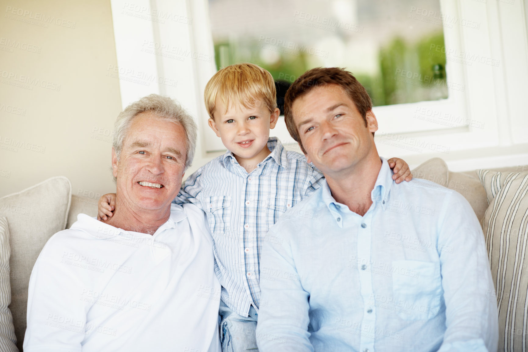 Buy stock photo Family, portrait and old man with child on sofa, generations or connection with grandchild in lounge. Senior dad, support and people with smile for kid, love and fathers day celebration in house