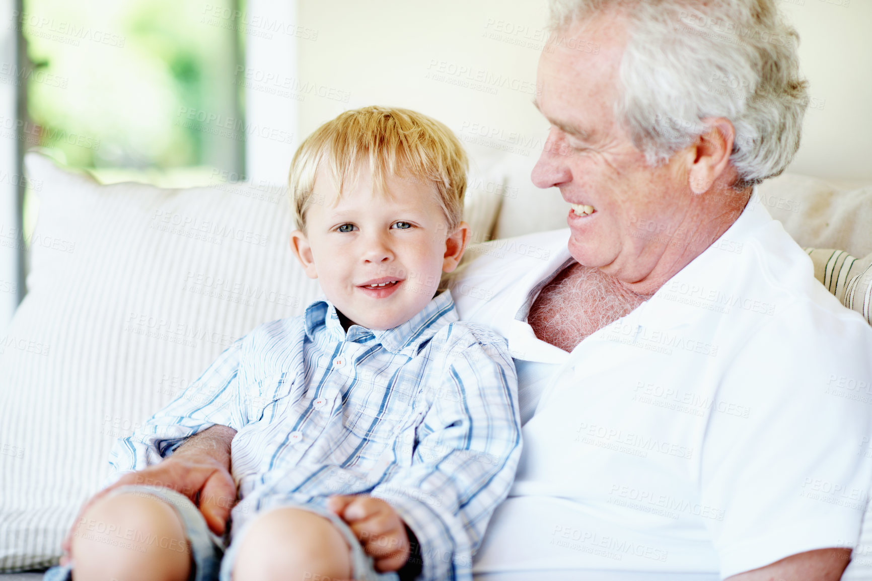 Buy stock photo Laugh, portrait and grandfather with child on sofa for bonding, relationship and visit on weekend. Family, happy and senior man with boy on couch for connection, support or affection in home together