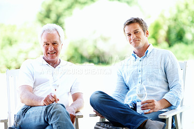 Buy stock photo Backyard, portrait and man with dad and wine for bonding, connection and relax on weekend. Family, garden and person with elderly father, alcohol and drink for holiday, relationship or chill together