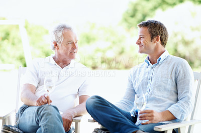 Buy stock photo Wine, garden and man with senior father for bonding, conversation and relax on weekend. Family, backyard and person with elderly parent, alcohol and drink for connection, relationship and talking