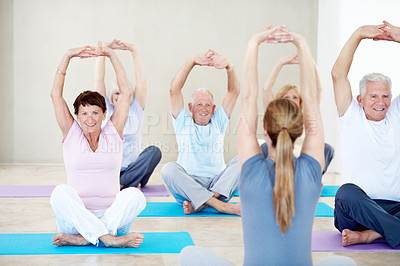 Buy stock photo Coach, stretching and elderly people in yoga class for holistic exercise, balance or activity together. Personal trainer, instructor and senior group with warm up for flexibility, health or fitness