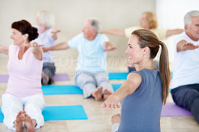 Buy stock photo Smile, woman and stretching with old people for yoga, holistic balance or retirement hobby in class. Trainer, yogi and warm up with senior community for inner peace, fitness demonstration or wellness