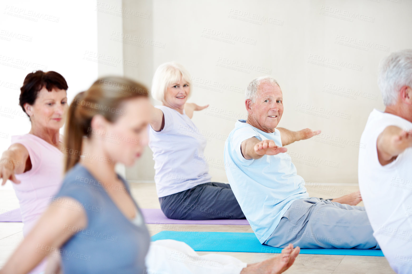 Buy stock photo Senior people, fitness and happy with personal trainer in gym, physical activity or training routine. Elderly group, portrait and stretching with instructor, workout and warm up for wellness in class